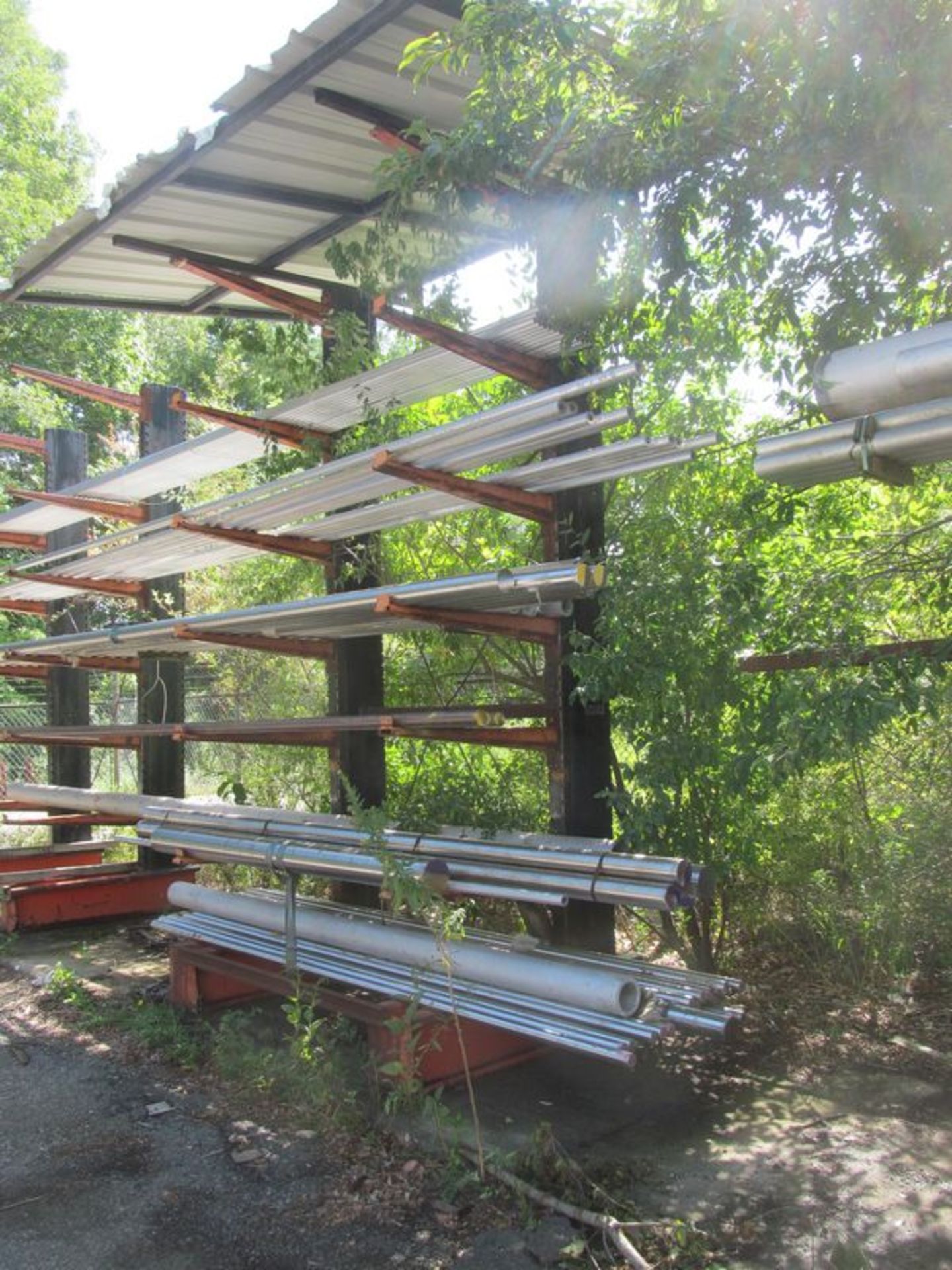 6 tier cantilevered metal stock rack, 76"w x 60" deep x 14' high with cover and (12) 44"