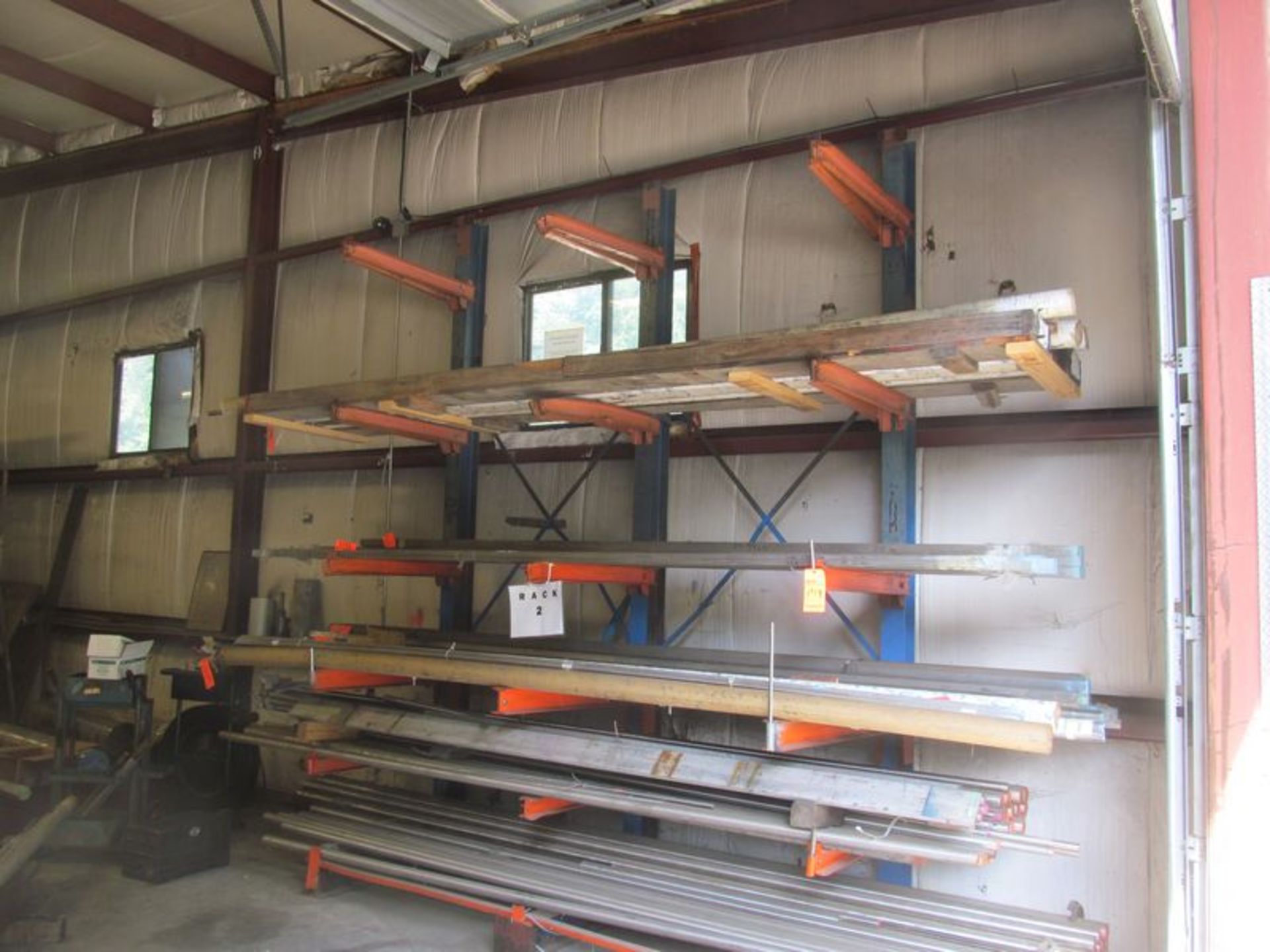 6 tier cantilevered metal stock rack, 102"w x 42" deep x 12' high with (15) 32" adjustable arms,