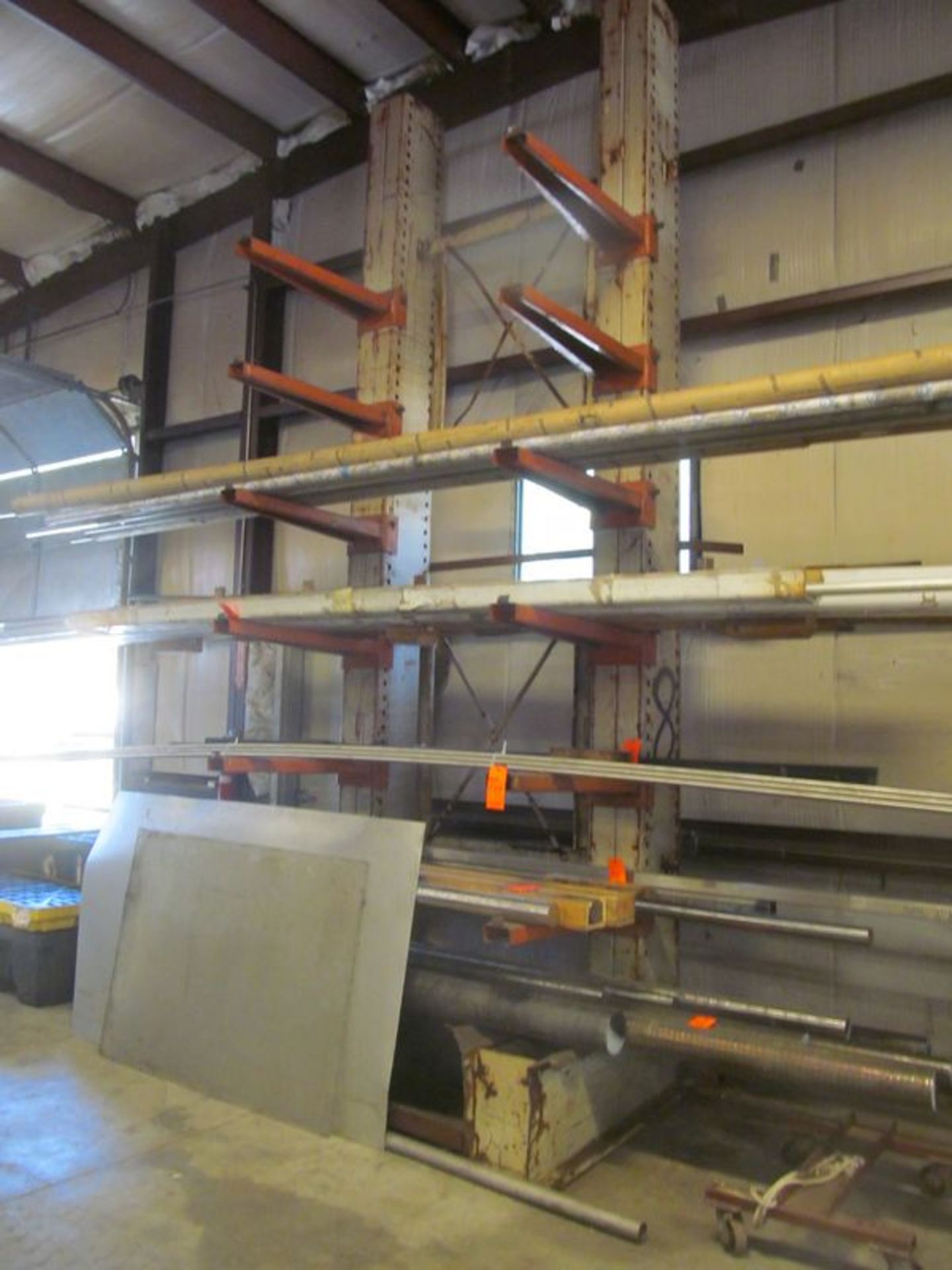 7 tier cantilevered metal stock rack, 66"w x 56" deep x 15' high, with (12) 36" long adjustable