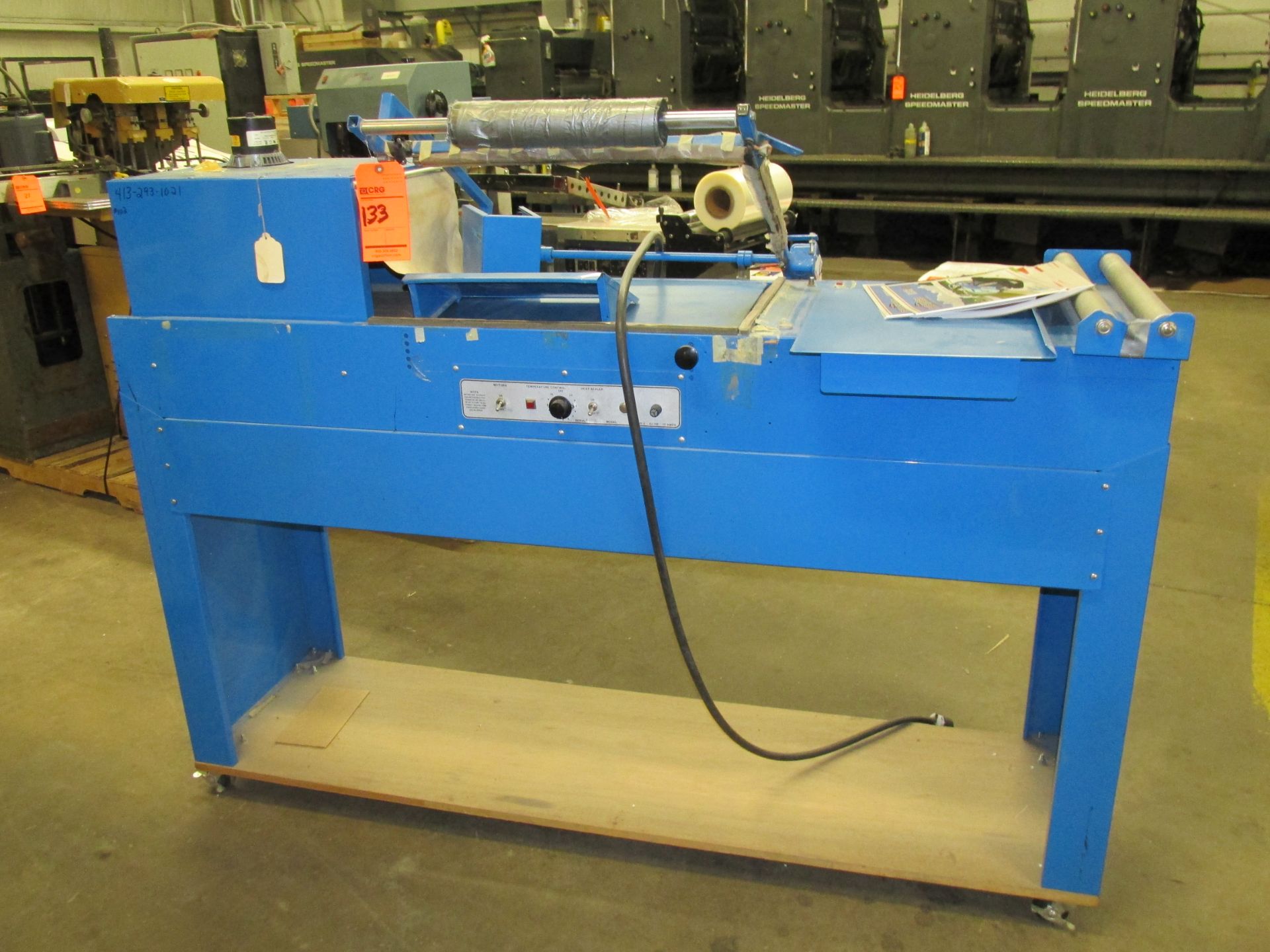 Blue shrink wrapping machine with L-sealer