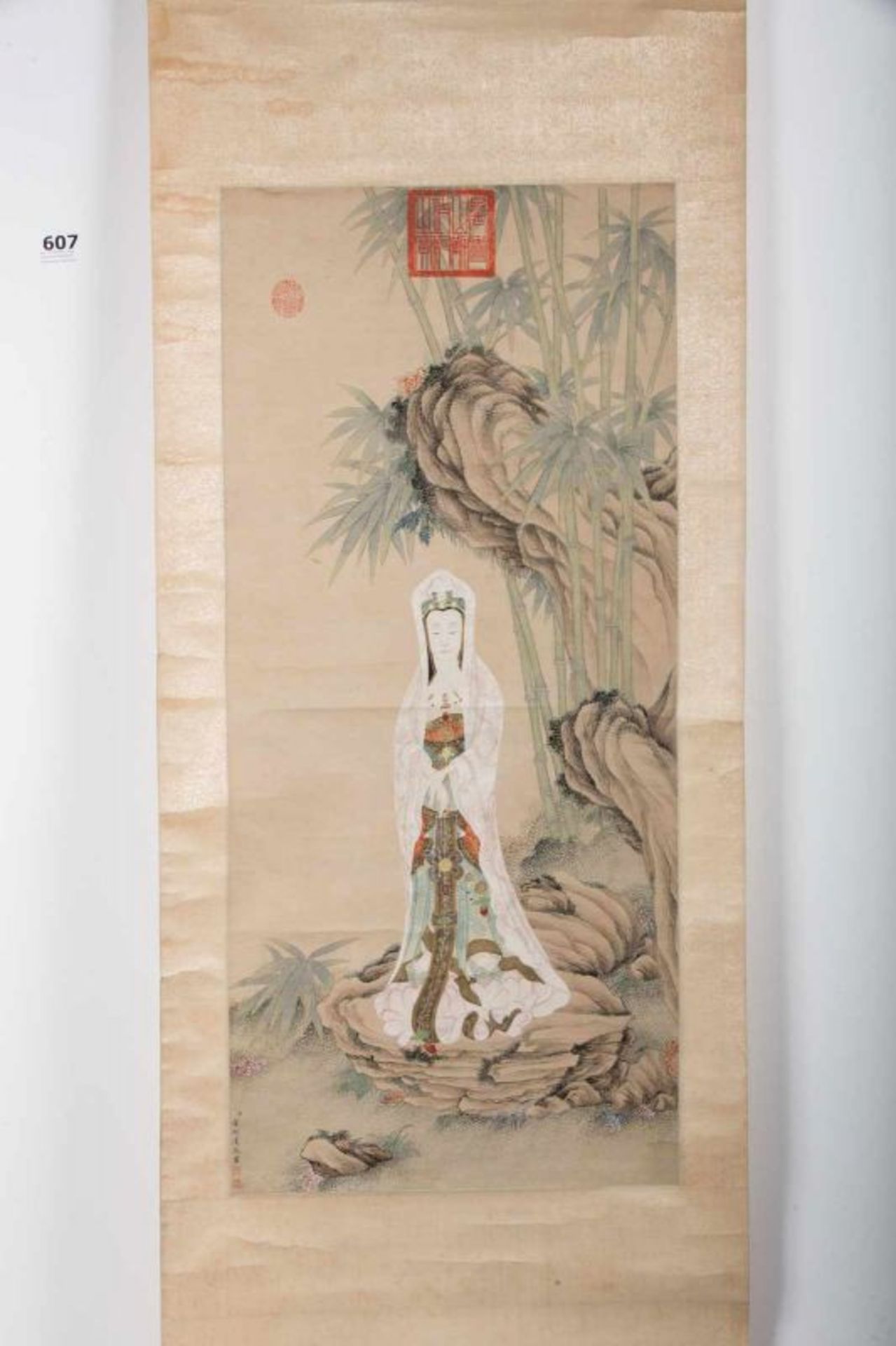 An ink and colour scroll paiting on paper depicting Guanyin in the ...