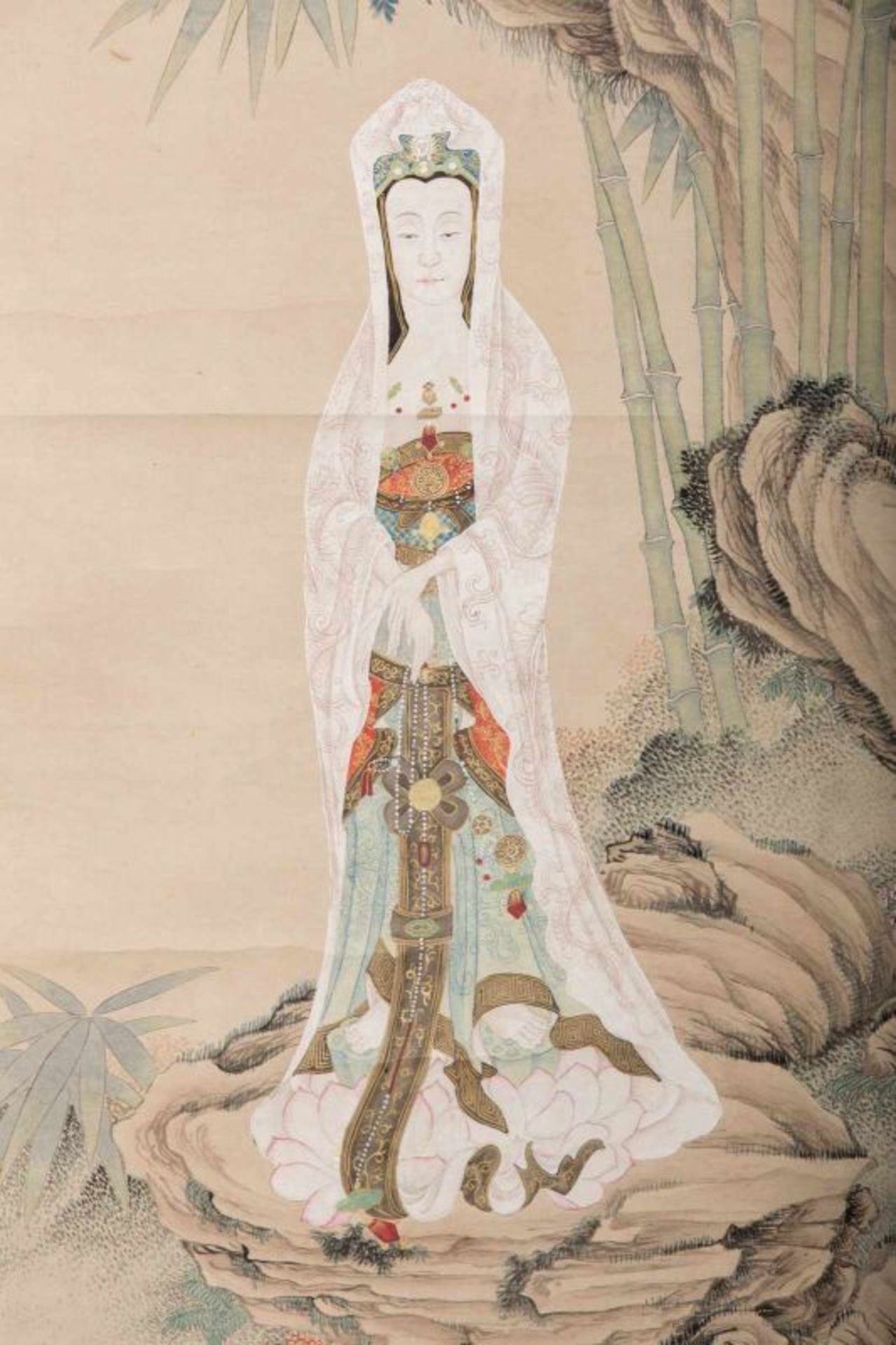An ink and colour scroll paiting on paper depicting Guanyin in the ...