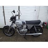 A 1978 Yamaha XS250, registration number AKJ 509T, silver.