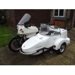 A 1982 BMW R80 combination, registration number GTP 66X, frame number 6210759, white.