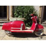 A 1959 NSU Prima 3 scooter, registration number 946 XUT, red.