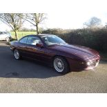 A 1997 BMW 840ci, registration number P840 TMR, maroon.