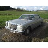 A 1969 Mercedes-Benz 250CE, registration number ANK 117G, silver.