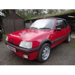 A 1990 Peugeot CTi 1.6 cabriolet, registration number G998 RGN, red.