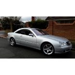 A 2002 Mercedes-Benz 500CL coupé, registration number NA02 TBV, brilliant silver.