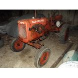 A 1952 Allis Chalmers Model B tractor, registration number KLG 494, orange.