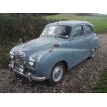 A 1954 Austin A40 Somerset, registration number OXK 616, grey/blue.