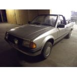 A 1983 Ford Escort Cabriolet, registration number B347 RDY, silver.