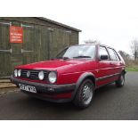 A 1991 Volkswagen Golf Driver, registration number H277 WYA, red.