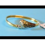 A 14ct gold leopard's head bangle, with