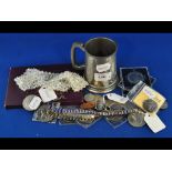 Assorted coins, a silver ingot, mounted