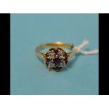 An 18ct gold, ruby and diamond cluster r
