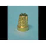 An 18ct gold and jade thimble