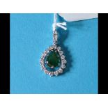An emerald and diamond pendant, the cent