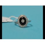 An Art Deco style 18ct white gold, onyx