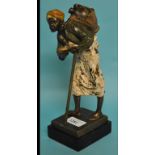 A painted bronze figure, the water carri