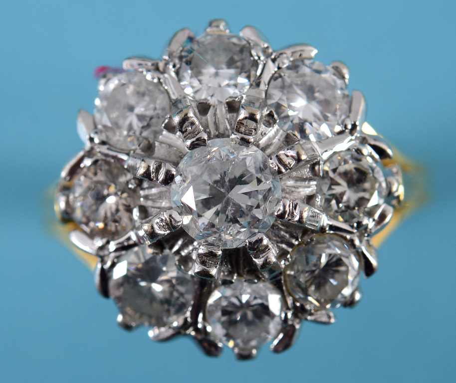 An 18ct gold and diamond flowerhead ring