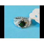 A platinum, tourmaline and diamond ring,