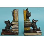 A pair of painted bronze bookends, in th