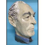 A pottery bust of a gentleman, signed Te