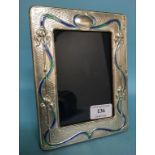 A silver photograph frame, with enamel s