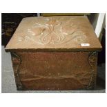 An Art Nouveau style hammered copper coal bin, decorated tulips, 49 cm wide,