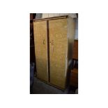 A 1960s retro wood effect two door wardrobe, 92 cm wide, and a matching dressing chest table,