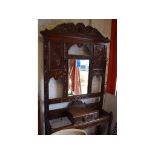 A late Victorian Anglo-Flemish carved and stained oak hall stand, mirror with some spotting,