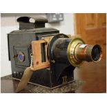 A black lacquered and brass magic lantern,