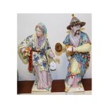 A pair of Chinese porcelain figures, the