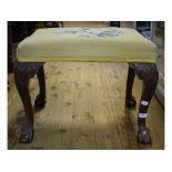 An upholstered stool, on claw and ball f