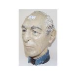 A pottery bust of a gentleman, signed Te