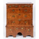 A chest on stand, veneered in walnut, an