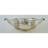 A silver pierced basket, of oval serpentine form, Birmingham 1907, approx. 10.