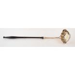 A George II silver toddy ladle, crested, with engraved decoration,