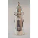 A novelty plated cocktail shaker, in the form of a lighthouse,