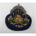 An embroidered evening bag, with silver mounts,