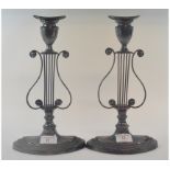 A pair of silver plated candlesticks, of lyre form,on navette bases,