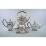 A silver plated kettle on stand with burner, 30 cm high, and a silver plated four piece tea service,