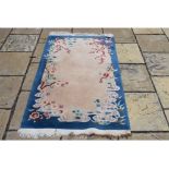 A Chinese rug, 94 x 171 cm