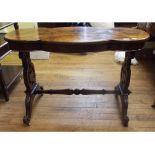 A Victorian walnut table, with a shaped