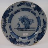 A Dutch Delft plate, decorated a figure