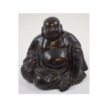 A Japanese pottery figure, of Hotei, 14