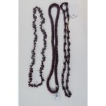 A garnet bead necklace, and two others s