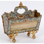 A gilt metal and onyx letter rack, with