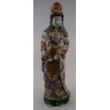 A Chinese figure, of a sage holding a sc